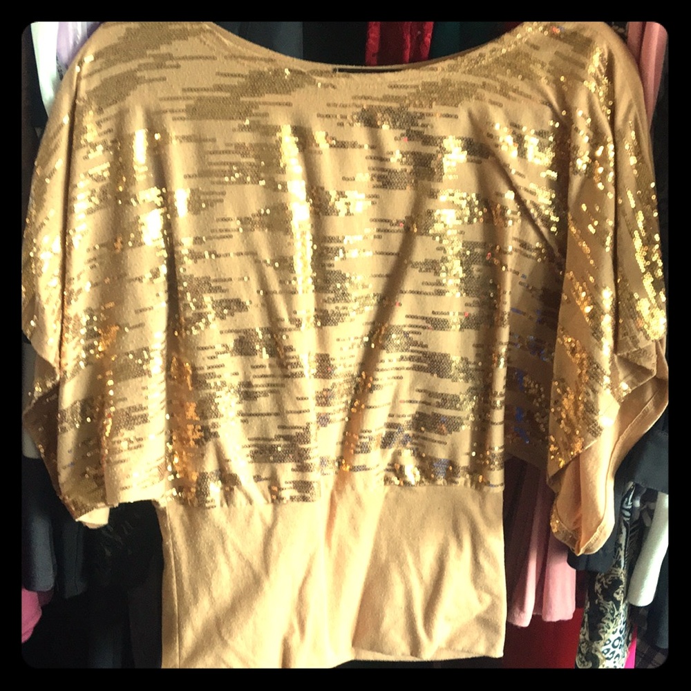 Gold shirt with sequins.